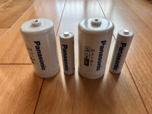 Panasonic battery spacers for converting AA batteries into D or C batteries.