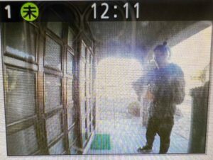 Blurred image of a person at the doorbell camera.